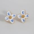 Caravanas flor blancas y celestes